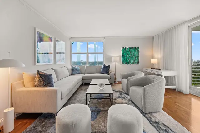 A living room with couches and chairs in it